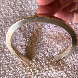 Silver Charm Bracelet with Intricate Detailing